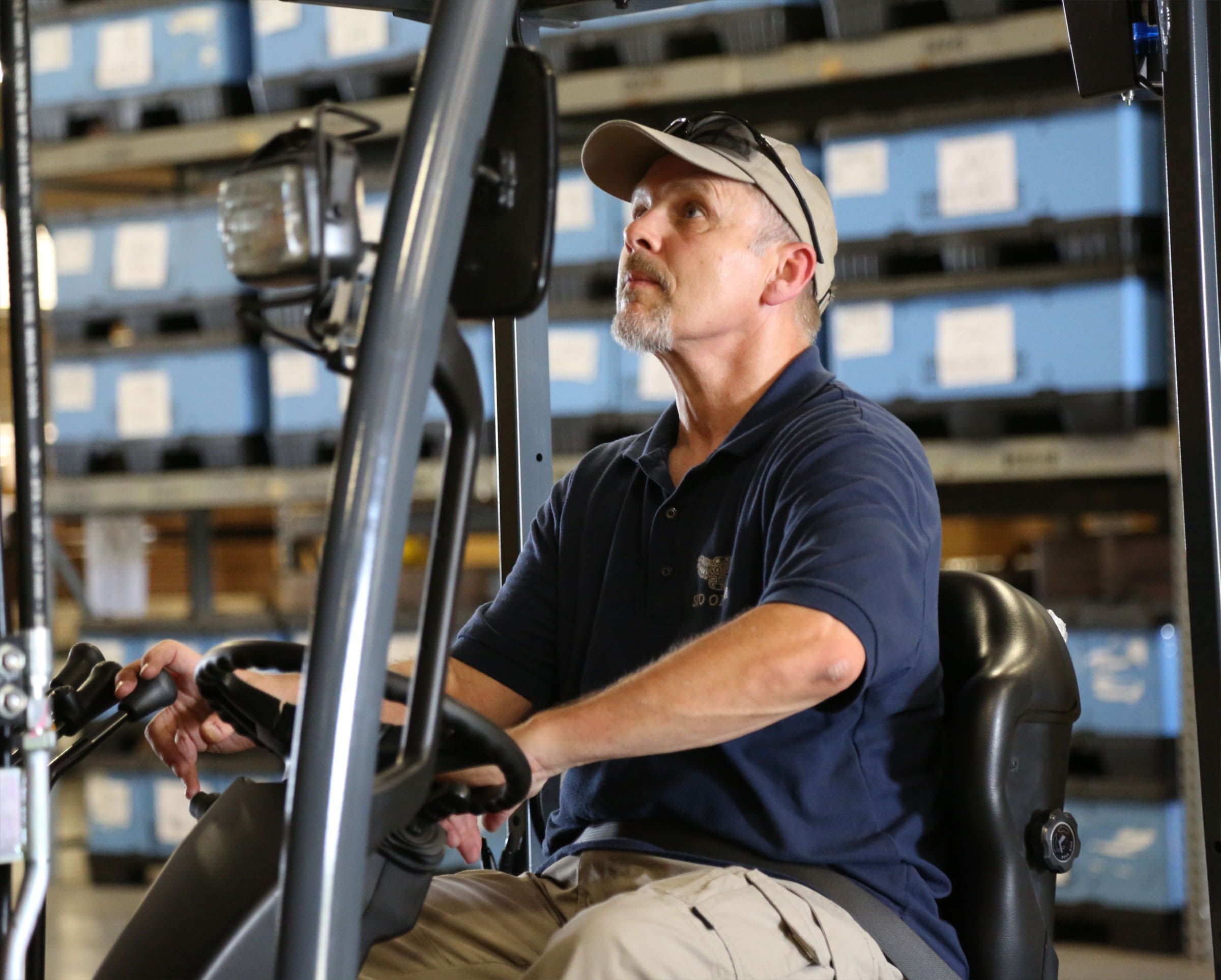 A man operating a forklift.