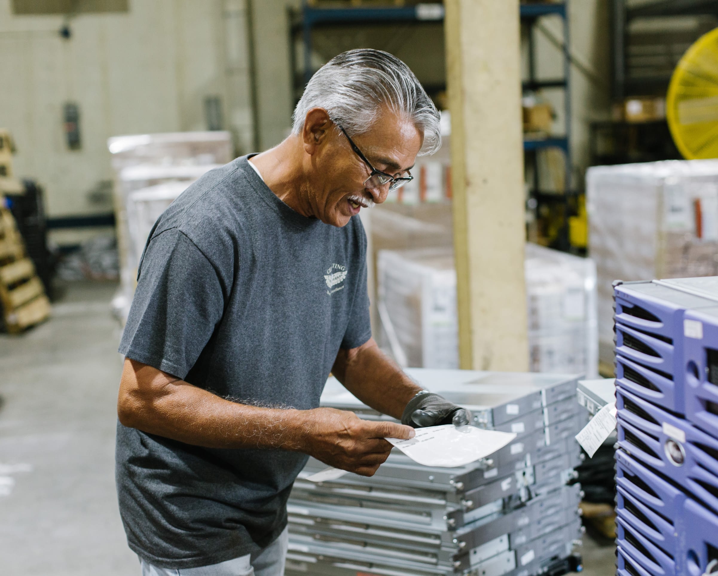 An employee is reviewing inventory.