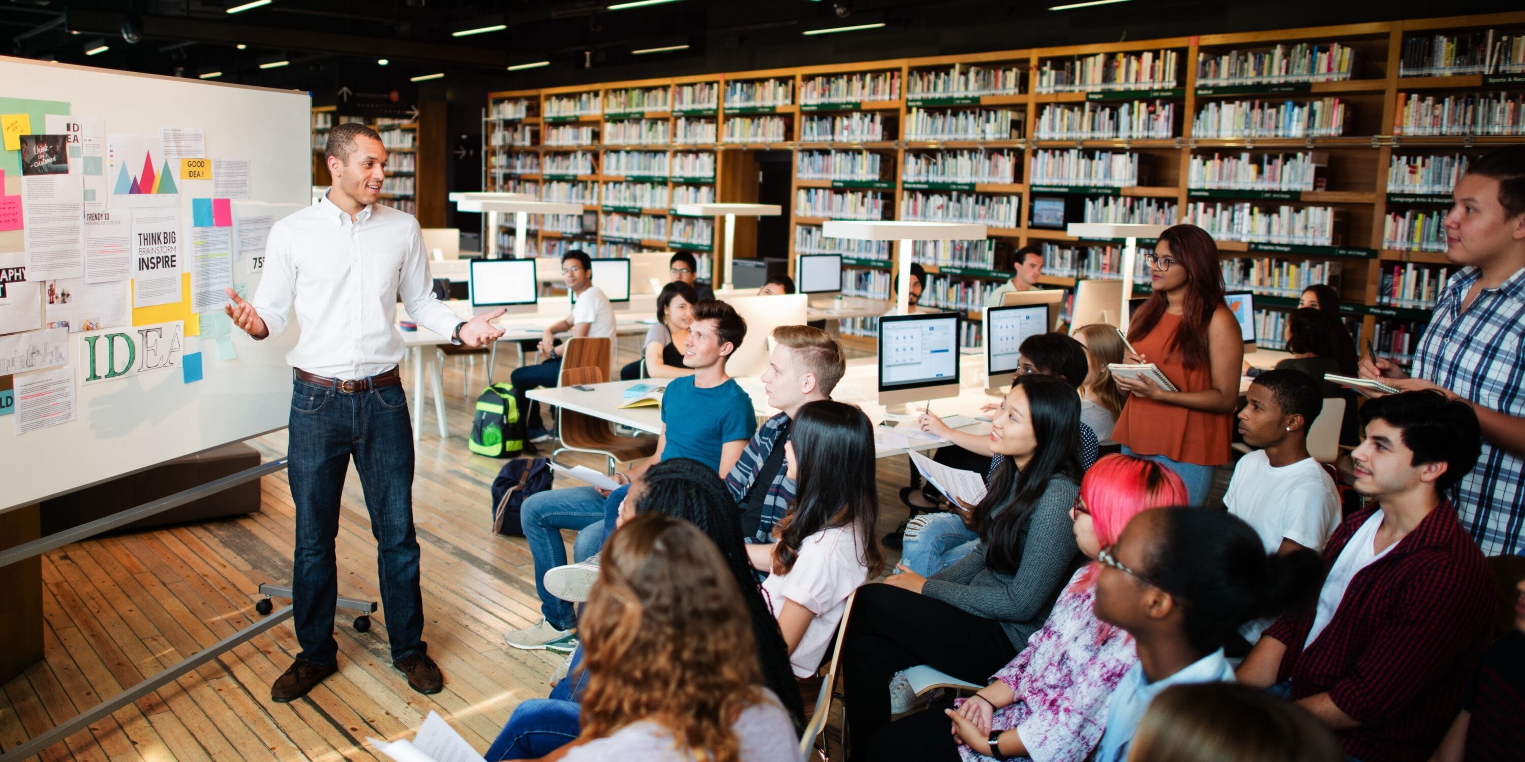 Young adult participating in Tessera’s career services program, engaged in a professional development session with a mentor, promoting youth career readiness and support.